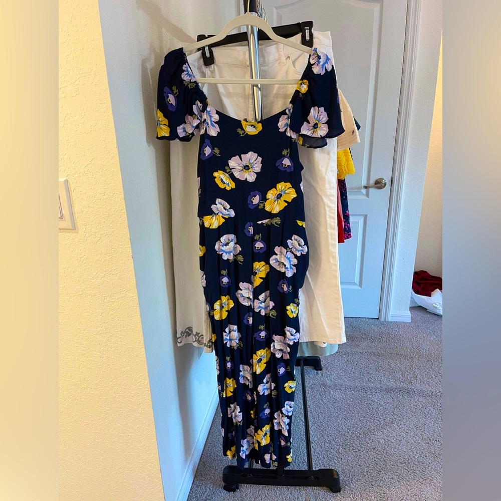 NWOT Loft floral jumpsuit with flutter sleeves. Size large petite.